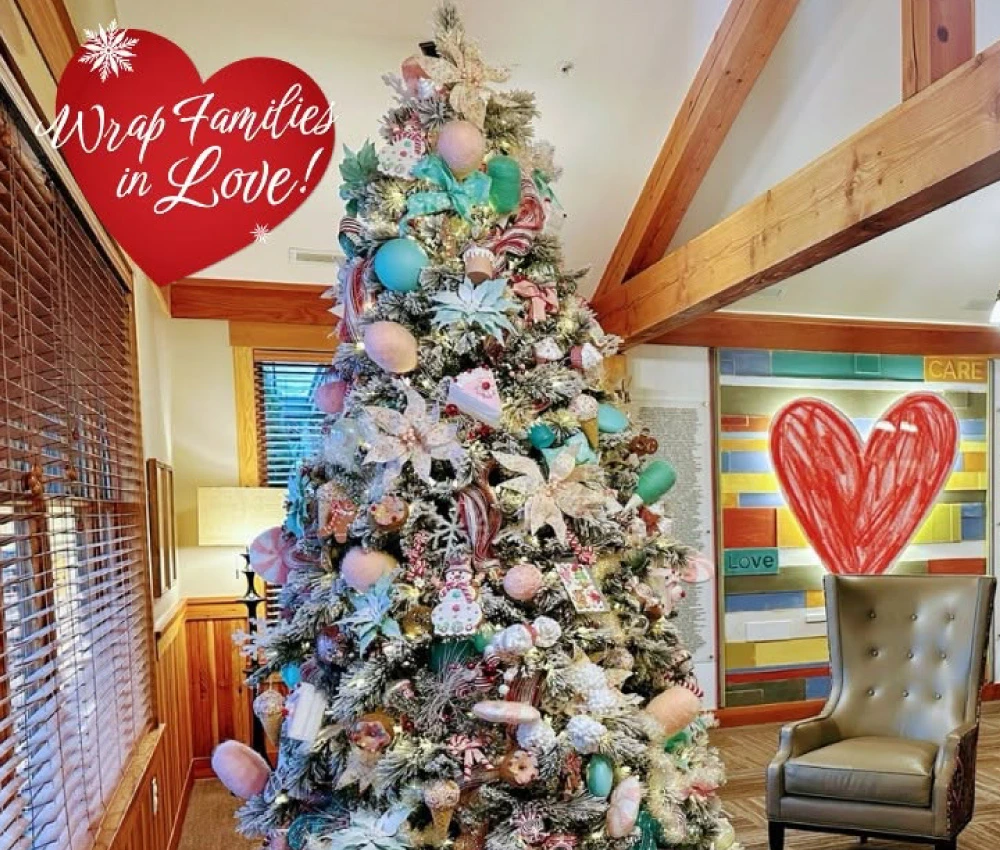 Decorated Christmas tree with a chair nearby for Santa Claus